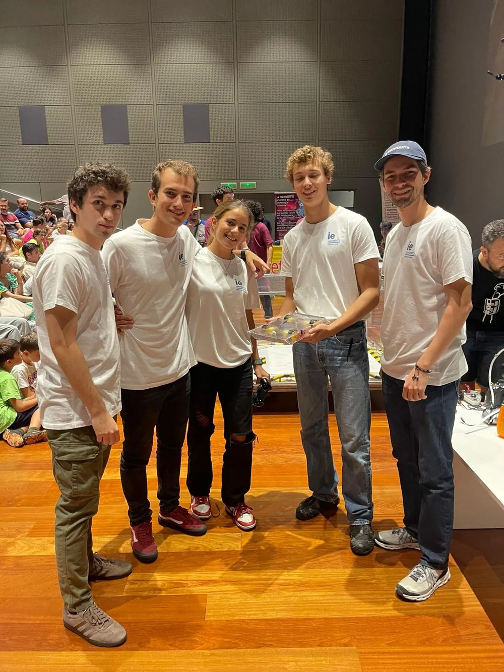 The IE Robotics Club team standing together at the OSHWDem venue.